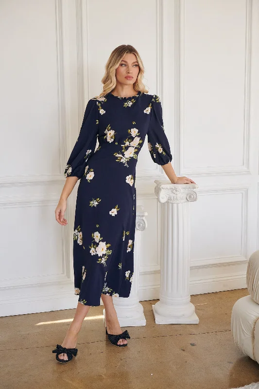 Midi dresses with geometric cutouts for a contemporary and edgy lookArlene Floral Smocked Midi Dress Midi dresses with geometric cutouts for a contemporary and edgy lookArlene Floral Smocked Midi Dress