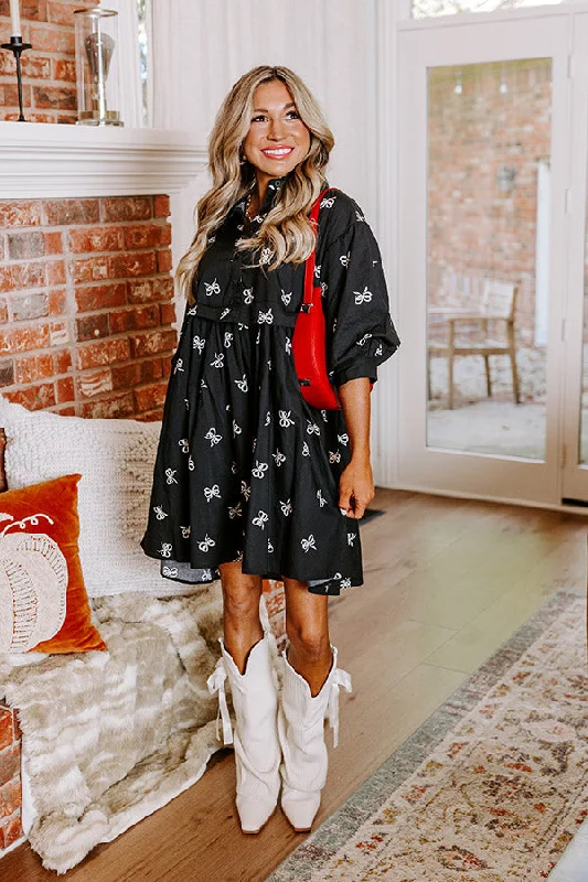 Mini dresses with belted waists for a defined silhouetteFor The Love Of Bows Mini Dress in Black Mini dresses with belted waists for a defined silhouetteFor The Love Of Bows Mini Dress in Black